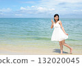 woman relaxing on the beach 132020045