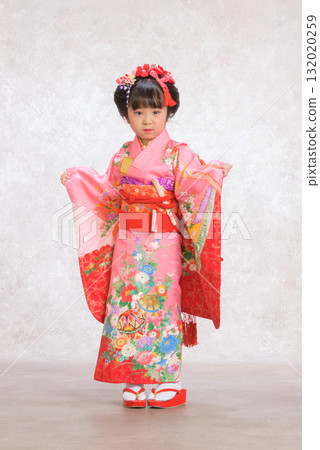 A girl in a kimono posing 132020259