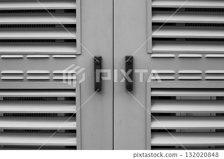 Industrial ventilation grilles with horizontal slats. Geometric design, in black and white tones, emphasizes texture and functionality, for architectural, industrial and design themes 132020848