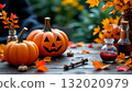 A festive autumnal scene with two pumpkins as the central focus 132020979