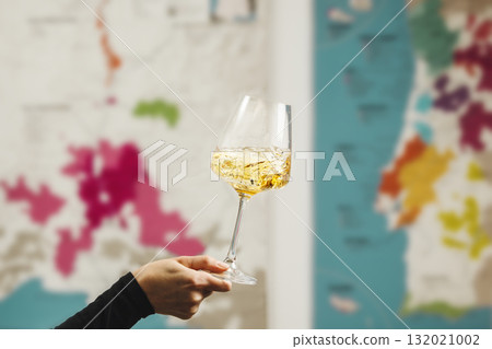 Swirling White Wine in Glass Against Wine Map Backdrop Swirling White Wine in Glass Against Wine Map Backdrop 132021002