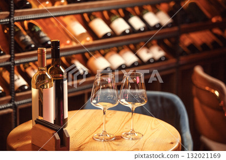 Wine Bottles and Glasses in Cellar Bar 132021169