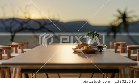 Bread on plate next to coffee cup on square table with armchairs on terrace or rooftop of restaurant Bread on plate next to coffee cup on square table with armchairs on terrace or rooftop of restaurant 132022519
