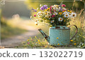 Rustic Flower Vase in Sunlit Garden.Turquoise watering can with wildflowers on grass, glowing in warm sunlight. Perfect for spring, nature, and romantic themes. 132022719