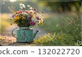 Rustic Flower Vase in Sunlit Garden.Turquoise watering can with wildflowers on grass, glowing in warm sunlight. Perfect for spring, nature, and romantic themes. 132022720