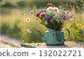 Rustic Flower Vase in Sunlit Garden.Turquoise watering can with wildflowers on grass, glowing in warm sunlight. Perfect for spring, nature, and romantic themes. 132022721