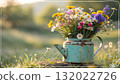 Rustic Flower Vase in Sunlit Garden.Turquoise watering can with wildflowers on grass, glowing in warm sunlight. Perfect for spring, nature, and romantic themes. 132022726