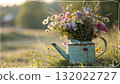 Rustic Flower Vase in Sunlit Garden.Turquoise watering can with wildflowers on grass, glowing in warm sunlight. Perfect for spring, nature, and romantic themes. 132022727