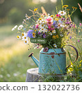 Rustic Flower Vase in Sunlit Garden.Turquoise watering can with wildflowers on grass, glowing in warm sunlight. Perfect for spring, nature, and romantic themes. 132022736