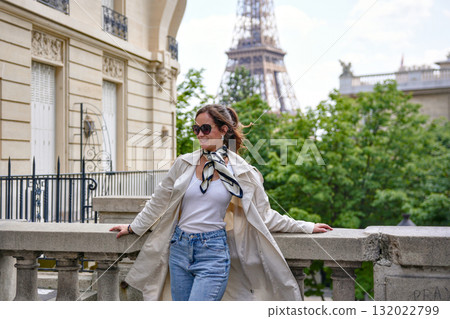 Chic woman sightseeing near Eiffel Tower in Paris 132022799