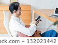 Male man who operates a smartphone 132023442