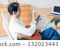 Male man who operates a smartphone 132023443