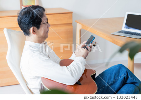 Male man who operates a smartphone 132023443