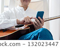 Male man who operates a smartphone 132023447