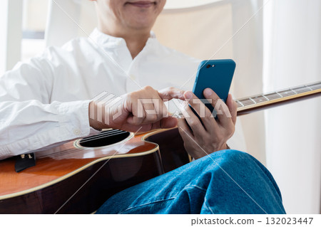Male man who operates a smartphone 132023447