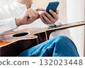 Male man who operates a smartphone 132023448