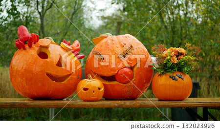 Halloween smiling carved pumpkin candles carved scary harvest jack o lantern autumn fall flaring glowing monster celebration fun hokkaido pile harvesting Cucurbita maxima pepo moschata Europe 132023926