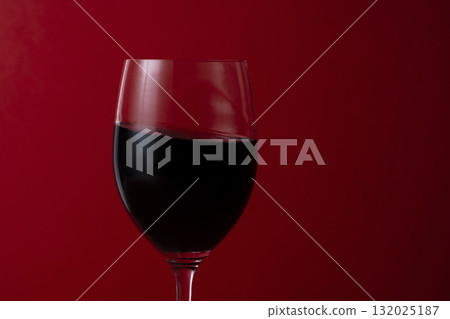 Close-up of a wine glass filled with red wine 132025187