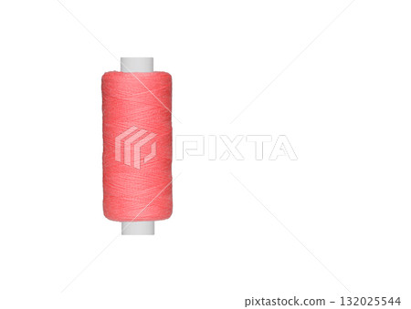 pink spool of sewing thread isolated on white background pink spool of sewing thread isolated on white background 132025544