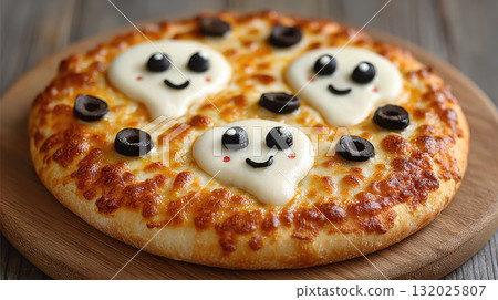 Cute ghost shaped cheese pizza with olive eyes and smiles 132025807