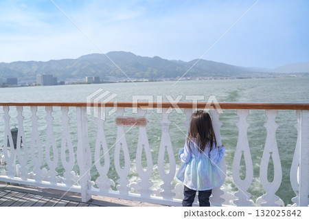 Girl looking at the sea Girl looking at the sea 132025842
