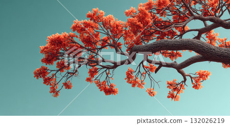 Floral branch with vibrant orange flowers against clear blue sky 132026219