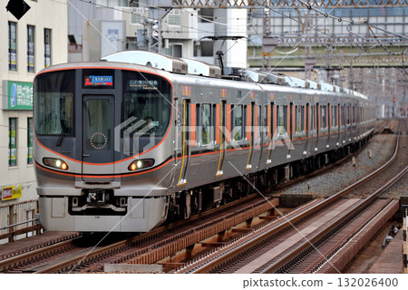 Eight 323 series rapid Expoliner cars running on the Umeda freight line 132026400