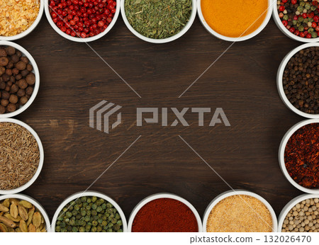 Frame of assorted spices in bowls 132026470