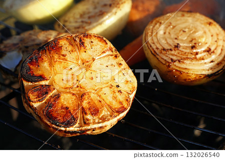 Grilled vegetables cooking on a barbecue grill with smoke Grilled vegetables cooking on a barbecue grill with smoke 132026540