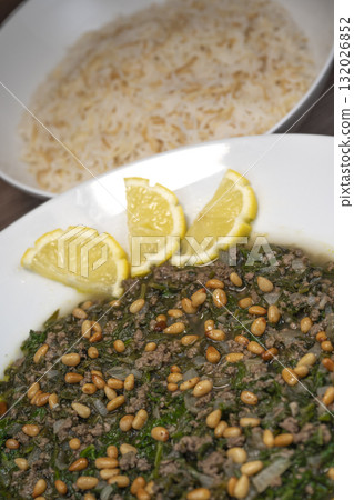 Spinach or Sabanekh with chicken a Mediterranean dish served with rice Spinach or Sabanekh with chicken a Mediterranean dish served with rice 132026852