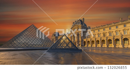 Paris, France - October 04 2025: Stunning sunset view of the Louvre with glass pyramid 132026855