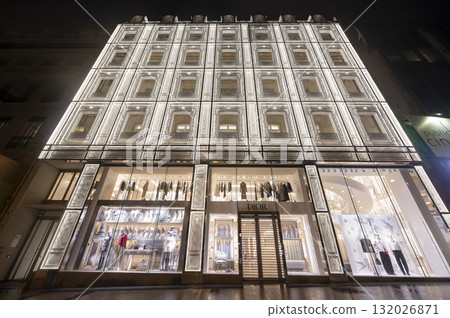 Paris, France - October 04 2025: Illuminated Paris Dior, Louis Vuiton boutique displays fashion Paris, France - October 04 2025: Illuminated Paris Dior, Louis Vuiton boutique displays fashion 132026871