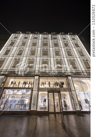 Paris, France - October 04 2025: Illuminated Paris Dior, Louis Vuiton boutique displays fashion 132026872