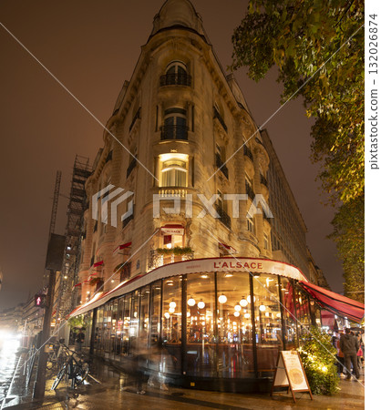 Charming Paris restaurant at night with warm lights and inviting ambiance Charming Paris restaurant at night with warm lights and inviting ambiance 132026874