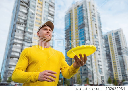 Ai generated Man holding frisbee preparing to throw in urban park sunset 132026984