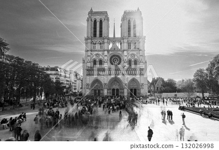 Visitors gather around Notre-Dame-de-Paris during sunset in black and white Visitors gather around Notre-Dame-de-Paris during sunset in black and white 132026998