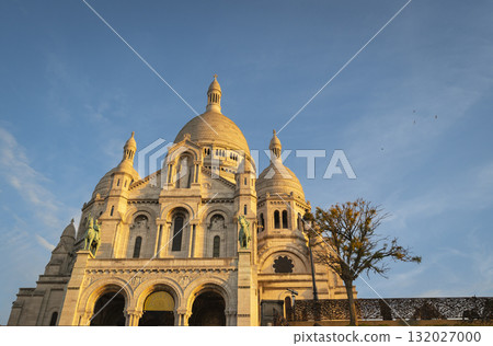 Montmartre sunset view of Sacre Coeur Basilica in Paris with vibrant skies Montmartre sunset view of Sacre Coeur Basilica in Paris with vibrant skies 132027000