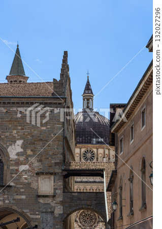 Ornate domes of Colleoni Chapel and Maria Maggiore rise amid old facades of Bergamo Alta 132027296
