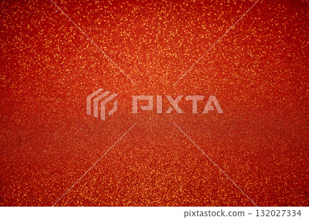 Red glittering surface with fine golden sparkles and radiant highlights for elegant design 132027334