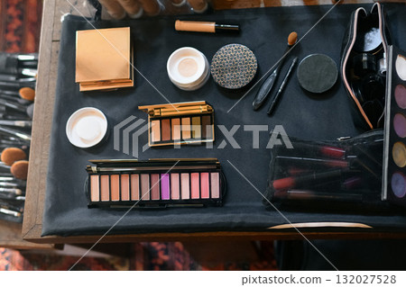 Cosmetics on the table lipstick foundation brush shadow 132027528
