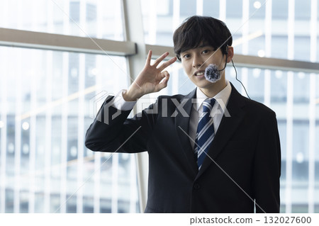 A smiling businessman to guide A smiling businessman to guide 132027600