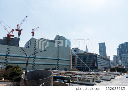 View of Shinjuku Station West Exit, Odakyu Department Store and Keio Department Store, in front of Bic Camera, spring blue sky, Shinjuku-ku, Tokyo 132027685