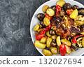 Appetizing baked pork with vegetables. 132027694
