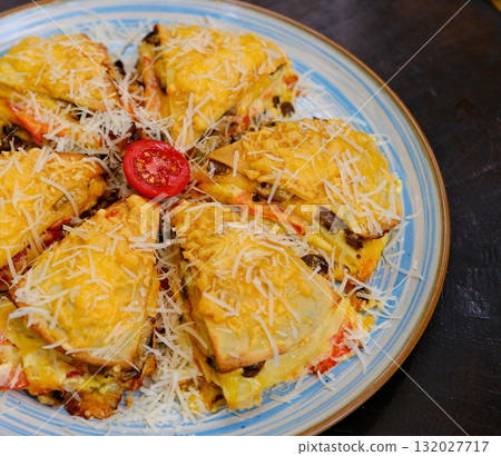 Homemade casserole with chicken, cheese, rice and parsley flakes Homemade casserole with chicken, cheese, rice and parsley flakes 132027717