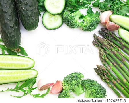 frame of green vegetables broccoli, arugula, cucumber, asparagus and garlic on white background frame of green vegetables broccoli, arugula, cucumber, asparagus and garlic on white background 132027743
