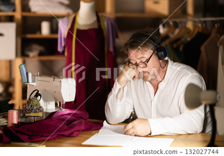 Male tailor draw create sketch of dress 132027744