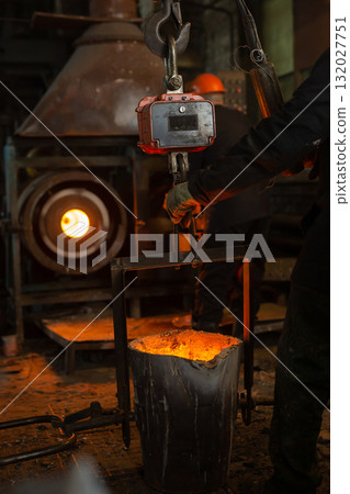 Foundry ladle with molten metal in workshop of metallurgical plant 132027751