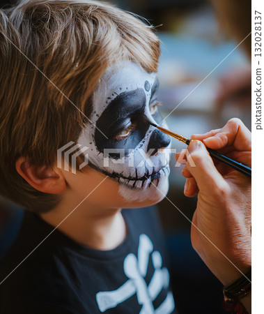 A boy wearing face paint for Halloween. Enjoy the autumn event with skeleton makeup. A boy wearing face paint for Halloween. Enjoy the autumn event with skeleton makeup. 132028137