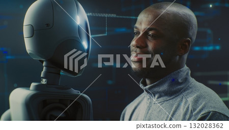 Guy Smiling Warmly While Looking Futuristic Robot With AI and Shiny Details Guy Smiling Warmly While Looking Futuristic Robot With AI and Shiny Details 132028362