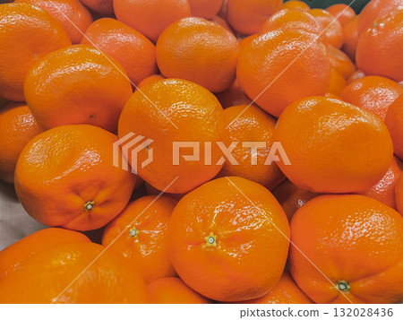 Abundance of bright orange fruits. Detailed texture of healthy, vitamin-rich mandarin or clementines Abundance of bright orange fruits. Detailed texture of healthy, vitamin-rich mandarin or clementines 132028436
